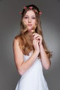 Graceful young woman with flowers