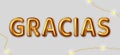 Gracias. Vector inscription gold letters on a gray background