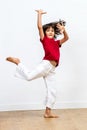 Gracious beautiful young girl dancing, showing joyous dynamic child movement Royalty Free Stock Photo