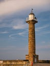 The Grade 2 listed historic sandstone tower of the East Pier Lighthouse in Whitby, North Yorkshire, England, UK