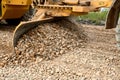 the grader blade levels the rubble at the construction site