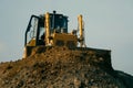 Grader moves clay in a quarry. Clay quarry Royalty Free Stock Photo