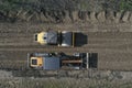 Grader road construction. A motor grader works on a site on a road under construction Royalty Free Stock Photo