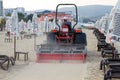 Grader Sifting Sand On Public Beach