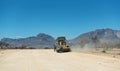 A grader working on a gravel road in Namibia, Africa