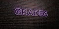 GRADES -Realistic Neon Sign on Brick Wall background - 3D rendered royalty free stock image