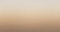 A gradient background featuring a smooth transition from light beige at the top to a deeper brown Royalty Free Stock Photo