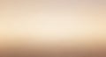 A gradient background featuring soft beige tones transitioning to a slightly darker hue. Royalty Free Stock Photo