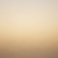 A gradient background with soft, muted tones transitioning from light beige at the top to a Royalty Free Stock Photo