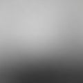 A gradient background transitioning from light gray at the top to dark gray at the bottom Royalty Free Stock Photo