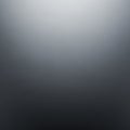 A gradient background transitioning from light gray at the top to darker gray at the bottom. Smooth Royalty Free Stock Photo