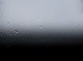 Gradient from black to gray water drops pattern with unfocused blurred bokeh abstract texture.Visual art concept image