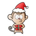 gradient cartoon of a christmas monkey wearing santa hat Royalty Free Stock Photo