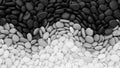 Gradient pattern of smooth pebbles creates a visual transition from dark Royalty Free Stock Photo