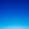A gradient of vibrant blue tones, transitioning from a lighter hue at the bottom to a Royalty Free Stock Photo