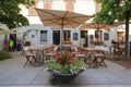Outdoor summer cafe in the old town of Grado