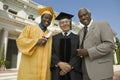 Graduate with dean and father outside university