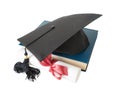 Graduate hat, book and scroll Royalty Free Stock Photo