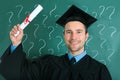 Graduate man holding diploma certificate Royalty Free Stock Photo