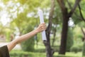 Graduate put her hands up and celebrating with certificate Royalty Free Stock Photo