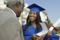 Graduate Student Receiving Gift From Father