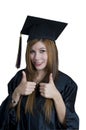 Graduate student with thumbs up sign Royalty Free Stock Photo