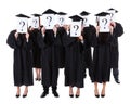 Graduate students showing question signs Royalty Free Stock Photo