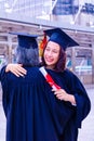 She is Graduate and wearing  graduate`s dress. Royalty Free Stock Photo