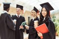 graduated multiethnic students with coffee Royalty Free Stock Photo