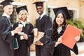 group of graduated multiethnic students with asian girl Royalty Free Stock Photo