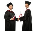 Graduated student men shaking hands