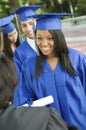 Graduates Collecting Certificate From Dean