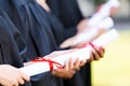 Graduates with diplomas. Royalty Free Stock Photo