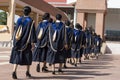 The graduates entered the auditorium