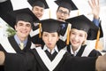 Graduates making selfie photo in classroom