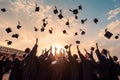 Graduates throwing their hats in the air. Concept of education and graduation, rear view of graduates throwing graduation caps in Royalty Free Stock Photo