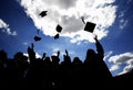 Graduates tossing hats Royalty Free Stock Photo