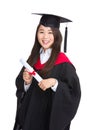 Graduating student girl with academic gown Royalty Free Stock Photo