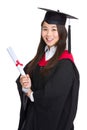 Graduating student girl with academic gown Royalty Free Stock Photo