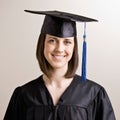 Graduating student wearing cap and gown Royalty Free Stock Photo