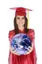 Caucasian teenager wearing a graduation gown holding the earth Royalty Free Stock Photo