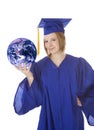 Caucasian teenager wearing a graduation gown holding the earth Royalty Free Stock Photo