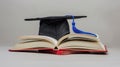 The graduation cap on book.AI generated image Royalty Free Stock Photo
