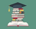 Graduation cap on book stack. Huge pile of books and encyclopedias, education and success concept. University library Royalty Free Stock Photo