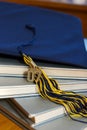 Graduation cap and books