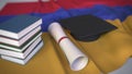 Graduation cap, books and diploma on the Armenian flag. Higher education in Armenia related conceptual 3D rendering