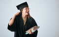 Graduation cap, books and happy woman isolated on studio background education, college or scholarship success mockup Royalty Free Stock Photo