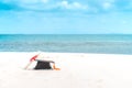 Graduation cap and certificated on the beach with beautiful sea in summer