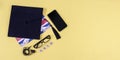 Graduation cap, glasses and and telephone. Royalty Free Stock Photo