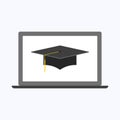 Graduation cap with gray laptop Royalty Free Stock Photo